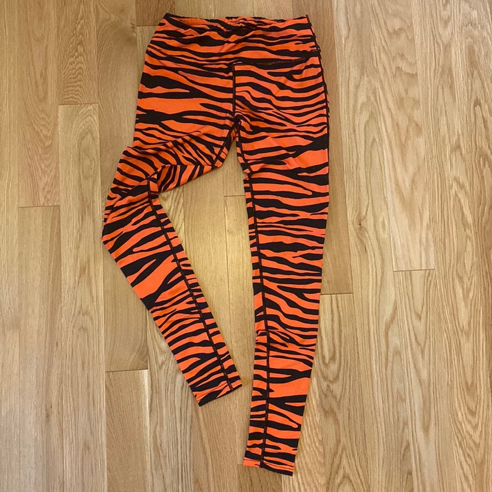Team Tights Orange & Black striped leggings. Size Small